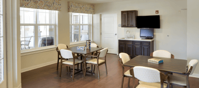 Bright common area with tables and chairs