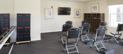 Interior room with exercise equipment and chairs
