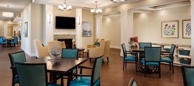 Bright common area with seating and tables