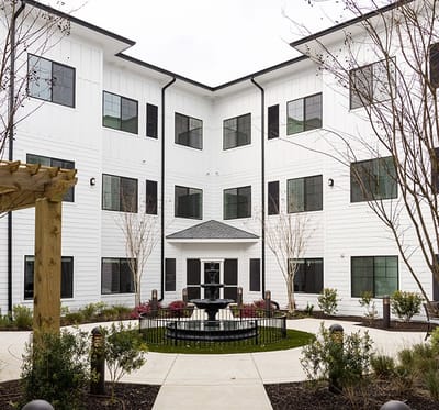 Outdoor courtyard with fountain and landscaping