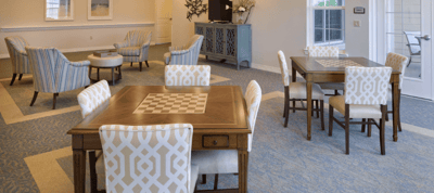 Bright common area with seating and game tables