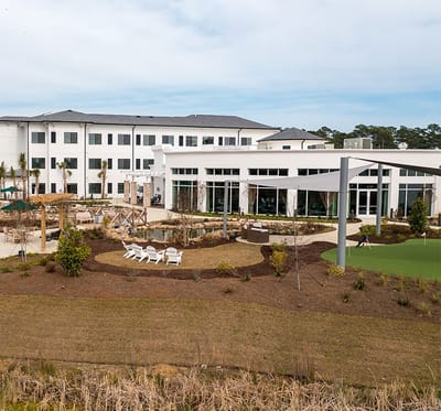 Exterior view of Watercrest Myrtle Beach with outdoor seating area