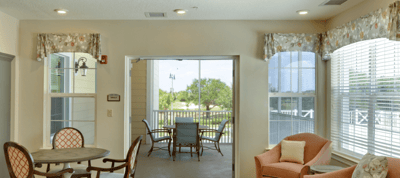 Bright common area with seating and large windows