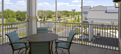Outdoor seating area overlooking gardens and pathways