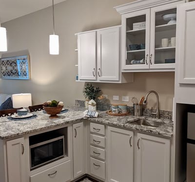 Modern kitchen area with appliances and decor