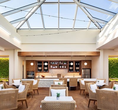 Bright and airy common area with seating and kitchen