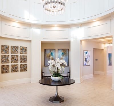 Modern lobby area with artistic decorations and floral centerpiece