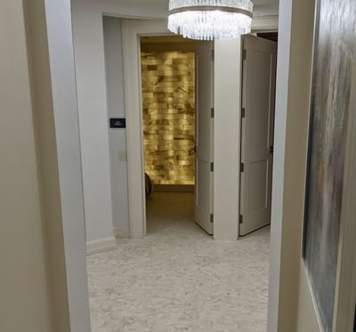 Interior hallway with open doors leading to rooms