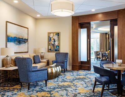 A cozy lounge area with seating and decor