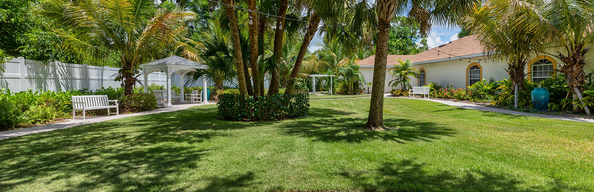 Lush garden area with seating and gazebo