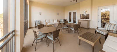 Outdoor seating area with tables and chairs