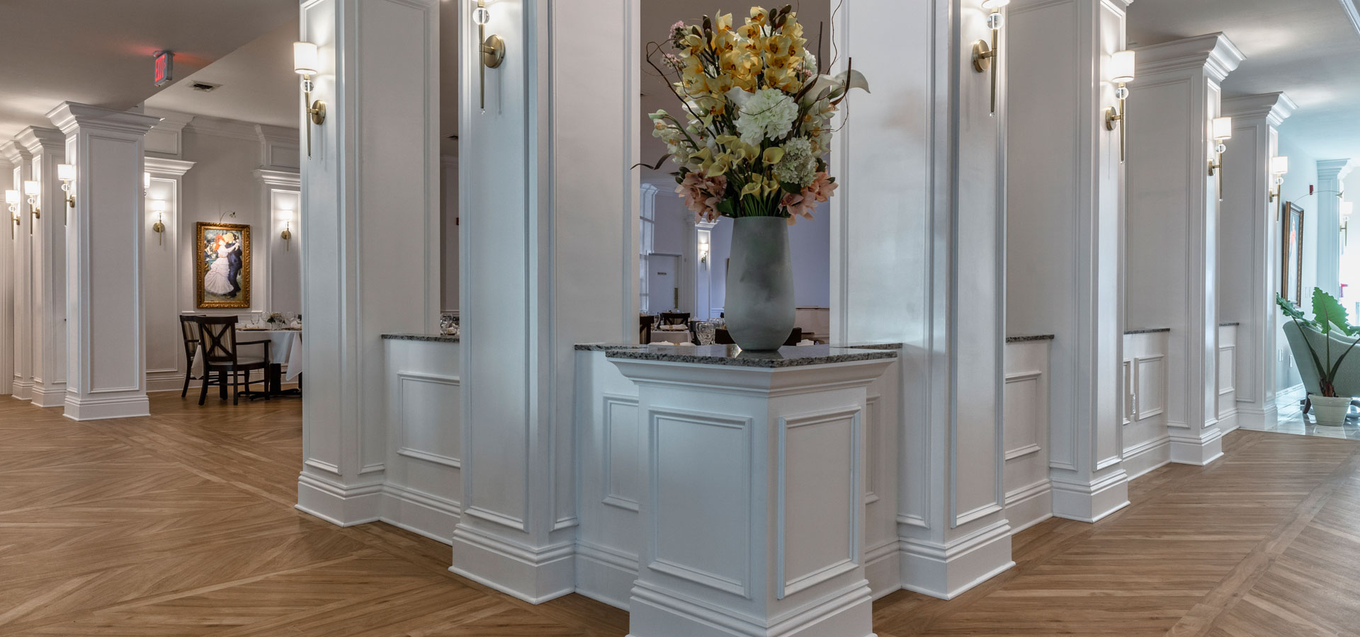 Bright, well-lit common area with floral arrangements