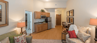 Cozy interior of a resident's suite with kitchenette