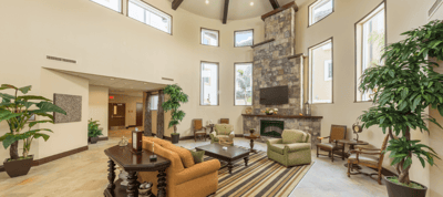 Bright and spacious lobby area with seating and plants