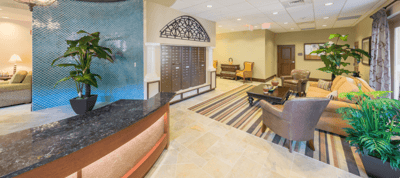 Bright lobby area with seating and decorative plants