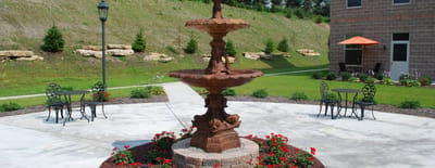 Outdoor courtyard with a fountain and seating