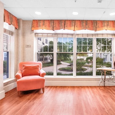 Bright interior common area with seating and large windows