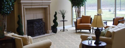 Bright common area with comfortable seating and fireplace
