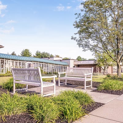 Outdoor seating area with benches and landscaping