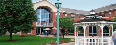 Outdoor area with gazebo and seating next to the facility