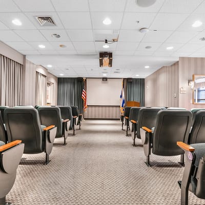 Interior view of a common area with seating and flags