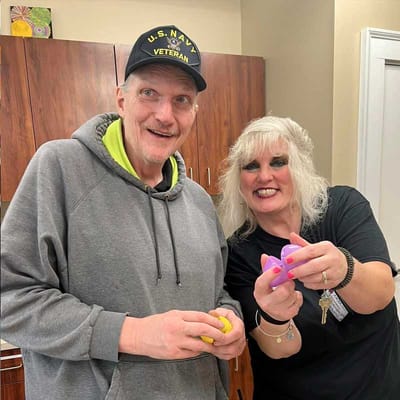 Resident and staff member enjoying activities together