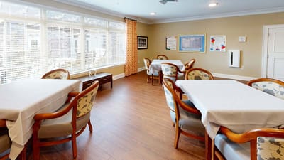 Bright dining area with tables and chairs