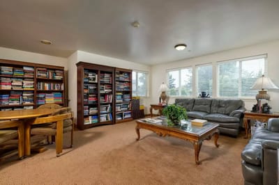 Cozy common area with seating and bookshelves