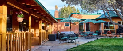 Outdoor patio area with seating and umbrellas