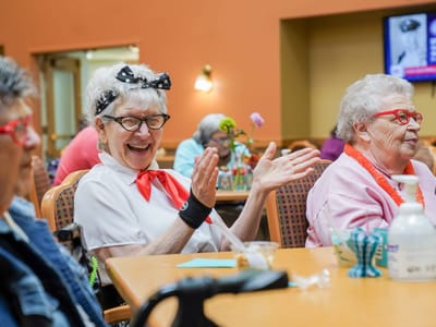 Residents enjoying a fun activity together in a common area