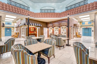 Common area with colorful seating and light decor