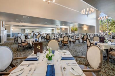 Dining room with tables set for a meal