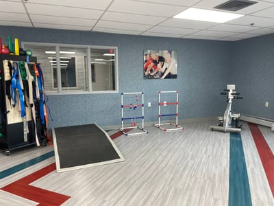 Interior view of a physical therapy room with equipment