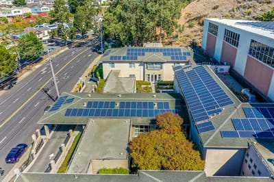 Aerial view of a senior living facility with solar panels