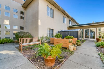 Outdoor space with benches and garden planters