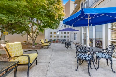 Outdoor seating area with chairs and umbrellas