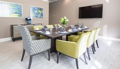 Neatly set dining room table in a modern interior