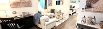 Cozy common area with seating and decor in a bright room