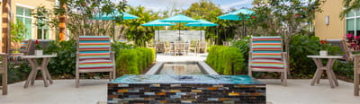 Beautiful outdoor patio area with seating and umbrellas