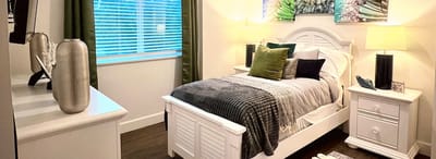 Cozy interior of a resident's bedroom with natural light