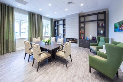 Bright common area with seating and bookshelves