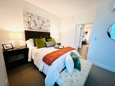 Cozy private room with a bed and decorative elements