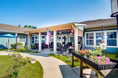 Outdoor patio area with seating and American flags