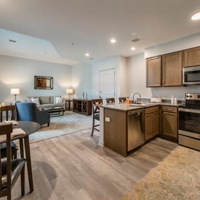 Modern interior of a resident's living space with kitchen and living area