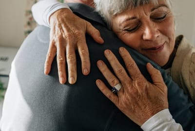 Meadowcrest – Middletown, Assisted Living in Middletown, DE — Residents sharing a warm hug in a cozy setting