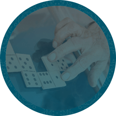 Meadowcrest – Middletown, Assisted Living in Middletown, DE — An elderly person's hand playing dominoes