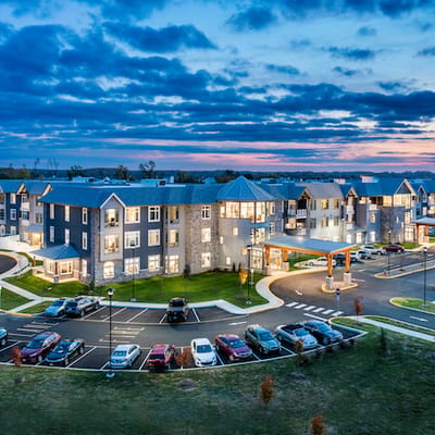 Aerial view of a modern assisted living facility at sunset
