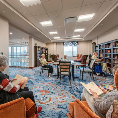 Meadowcrest – Middletown, Assisted Living in Middletown, DE — Residents reading in a cozy common area