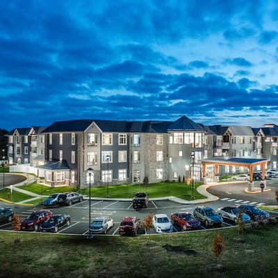 Exterior view of Meadowcrest with parking and landscaping