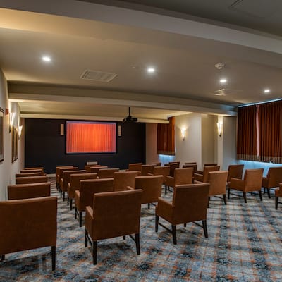 Interior view of a facility activity room with seating